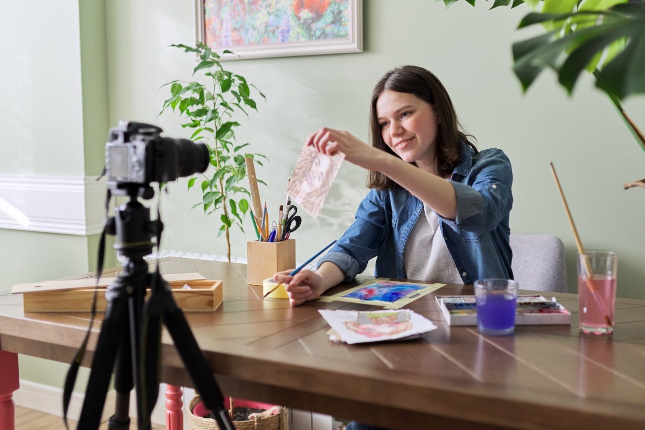 creative girl teenager artist painting in watercolor 1